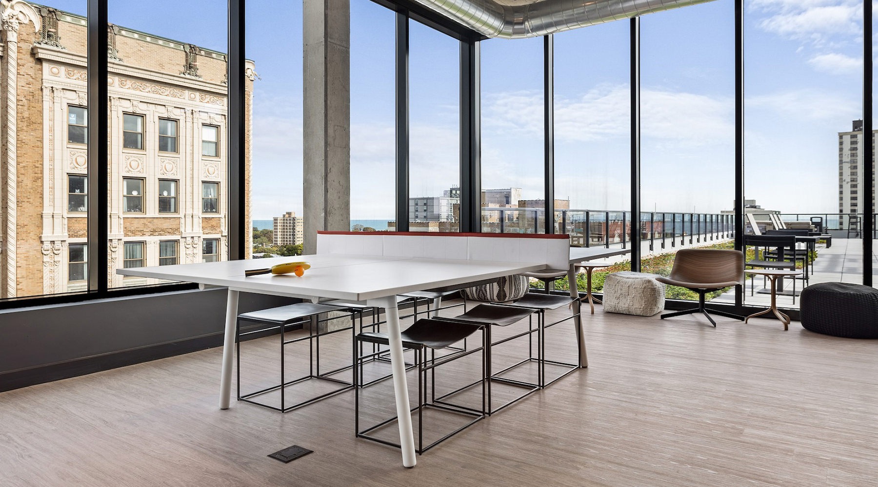 A spacious clubroom with ping pong